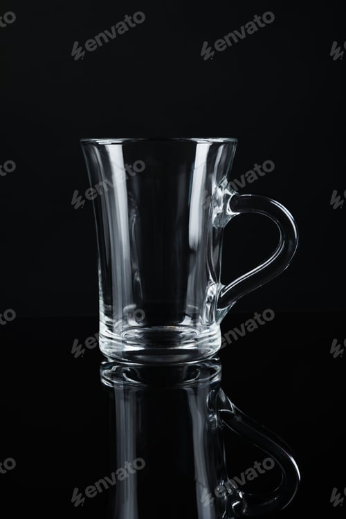Preview: Clean empty glass mug on black background