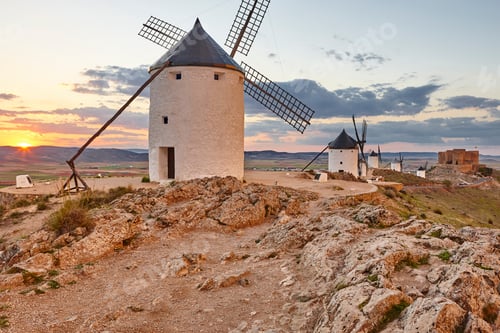 Preview: Traditional antique windmills at sunset in Spain. Consuegra, Toledo