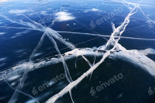 Preview: Transparent blue ice with cracks. Lake Baikal in winter.