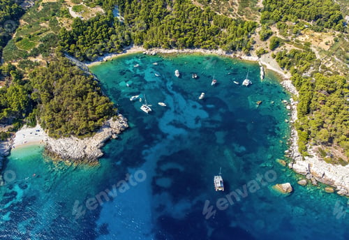 Preview: Aerial photo of boats moored near beautiful Velo Borce beach on Hvar island in Croatia