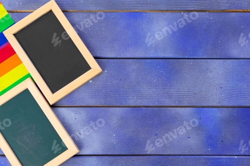 Preview: Bright rainbow gay flag on wooden background and blank space
