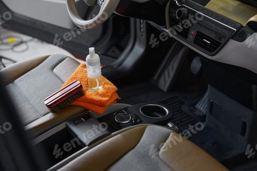 Preview: Cleansing brush, towel and detergent on front passenger car seat