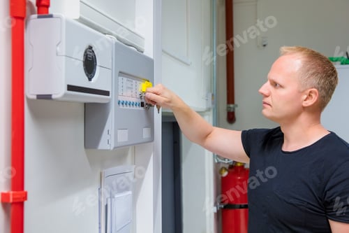 Preview: IT Engineer Opening Fire Panel In Server Room