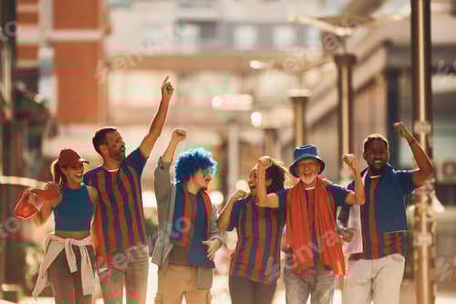 Preview: Cheerful sports fans having fun while celebrating on the street.