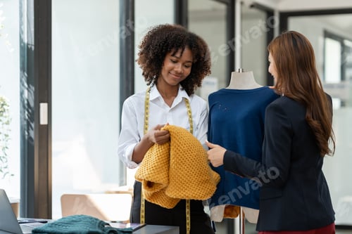 Preview: Fashion Designers Collaborating on Garment Creation