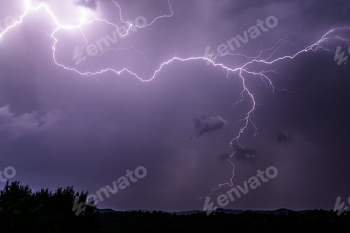 Preview: Powerful lightning strike in a bright purple sky