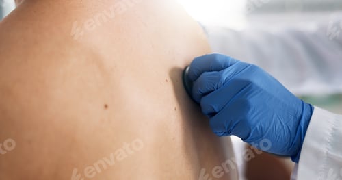 Preview: Doctor, hand and stethoscope on back of patient in hospital for breathing or respiratory examinatio