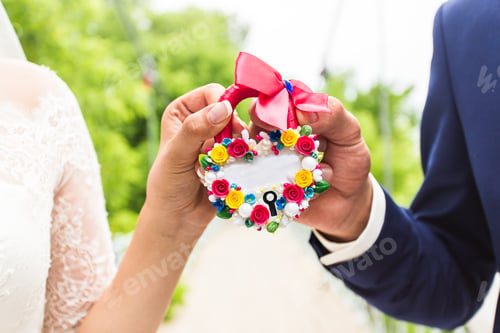 Preview: the lock in hands of newlyweds