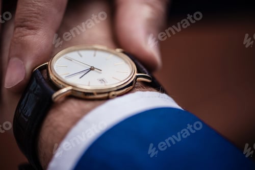 Preview: Wristwatch Detail, Gold Watch with Dark Leather Band
