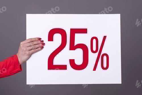 Preview: Female hand holding a 25% poster. Studio shot. Commercial concept.