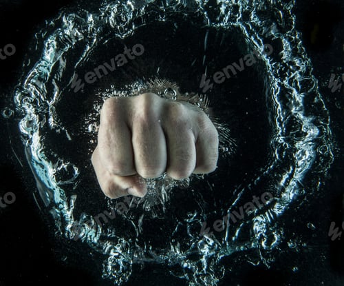 Preview: Close up of clenched fist beneath water