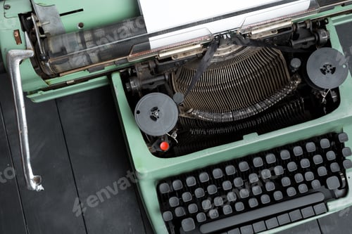 Preview: Vintage typewriter on a wooden table ready for creative writing and ideas generation