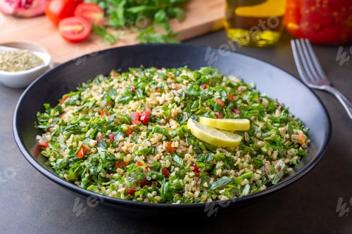 Preview: Traditional Lebanese salad tabouli tabule with quinoa, herbs, tomatoes, mint and lemon.