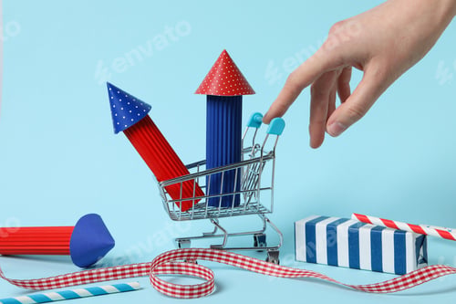 Preview: Paper fireworks with a gift on a blue background