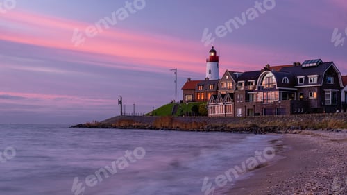 Preview: Urk Flevoland Netherlands sunset at the lighthouse and harbor of Urk Holland