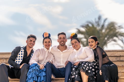 Visualização: retrato de um professor de flamenco com seus alunos sentados em alguns degraus