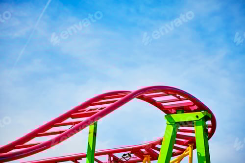 Preview: Roller coaster pink tracks in an amusement park.