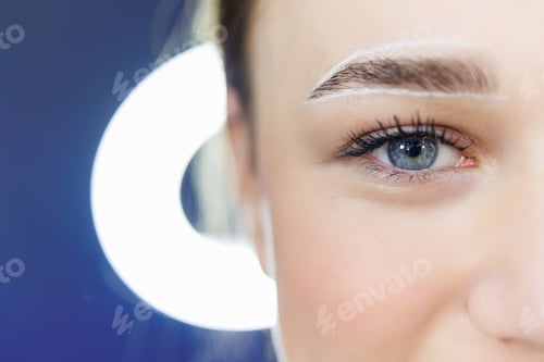 Preview: Care for a woman's face. Marking a woman's face before permanent eyebrow makeup.