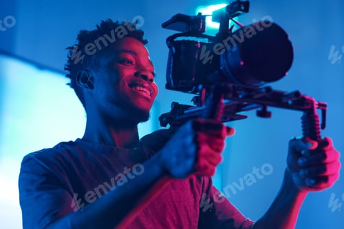 Preview: Cameraman shooting with professional camera