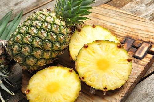 Preview: Fresh pineapple on wooden board