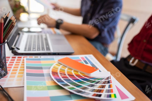 Preview: Asian colleagues designer drawing sketches on graphic laptop.