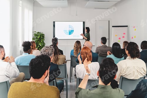 Preview: Business Presentation with Diverse Audience Applauding
