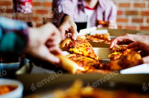 Preview: Friends eating pizza together at home