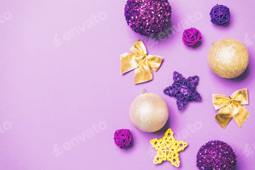 Preview: Top view of Christmas balls and creative decorations on colorful background