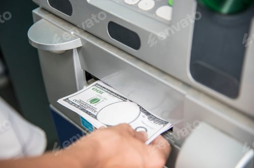 Preview: Closeup of a hand getting money from an ATM