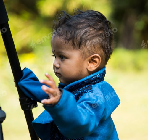 Preview: The one year old cute boy play in garden