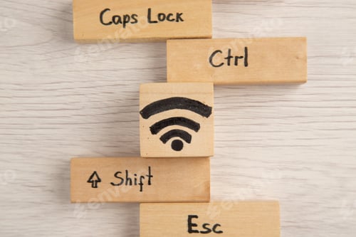 Preview: top view wifi shift caps lock ctrl esc icons on wood blocks on table
