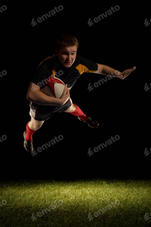 Preview: Rugby player mid air with ball