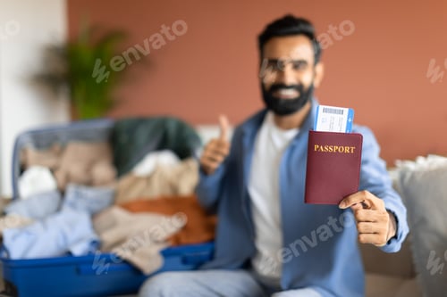 Preview: Arabic Man Showing Passport With Tickets Approving Tour At Home