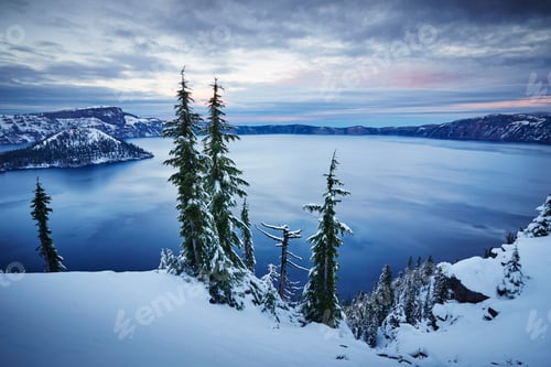 Preview: Serene winter twilight over a snowcovered lake