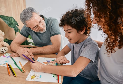 Preview: Curly male child with mother during art therapy with psychologist counsel at psychologist's office.