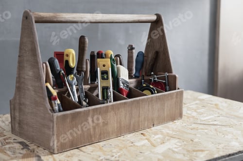 Preview: Construction tools and toolbox on wooden table background texture. Tool box kit