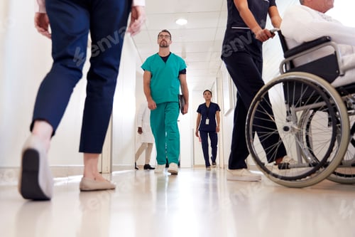 Preview: Busy Hospital Corridor With Medical Staff And Patients
