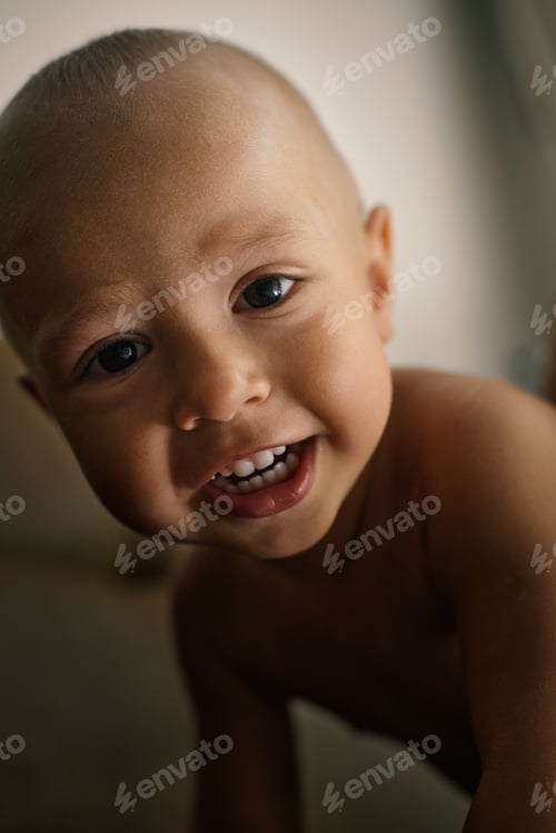 Preview: Portrait of a little European tanned boy. Cute happy face