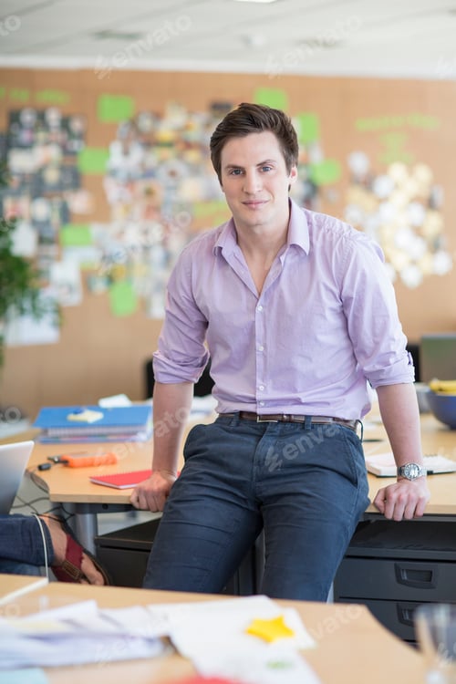 Preview: Young man in creative office