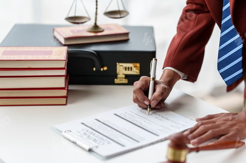 Preview: Business man hands close up working with contract lawyers specialize in dealing with the legal