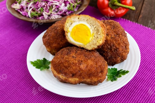 Preview: Meat mini-rolls (cutlet) with boiled egg. Close up