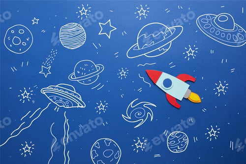 Preview: creative rocket on blue paper background with universe icons