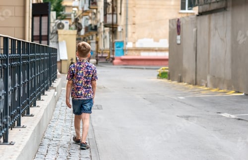 Preview: A boy walks down the street