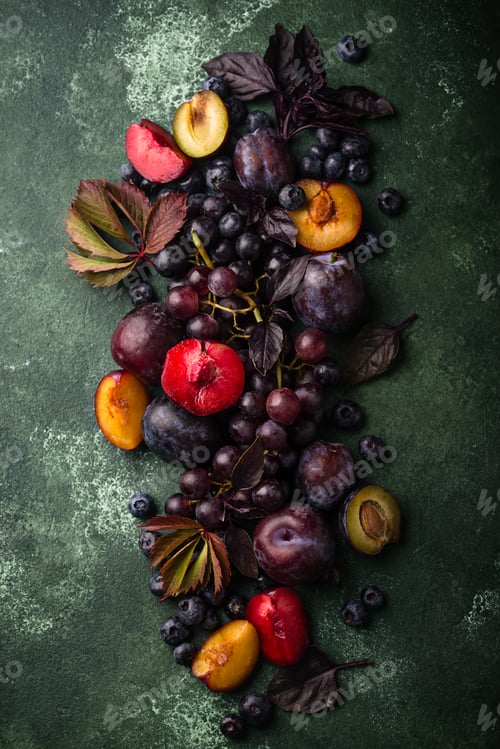 Preview: Assortment of purple fruit plum, grape, blueberry and basil