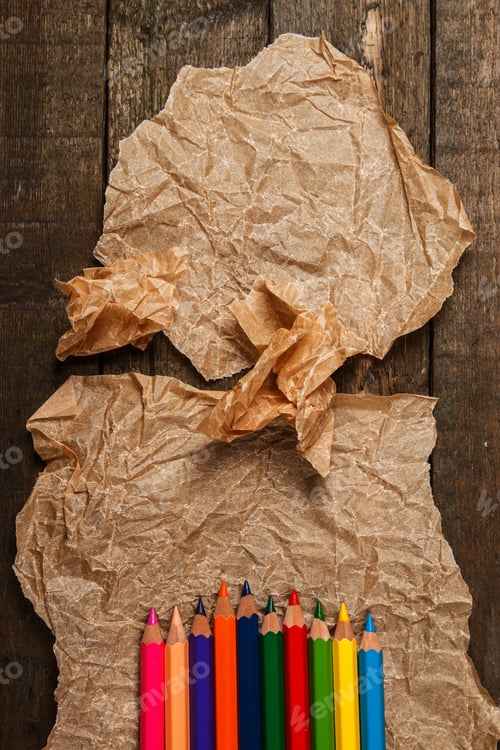 Preview: Multicolored pencils and crumpled paper