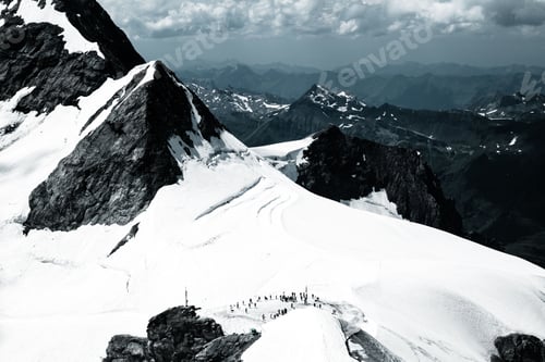 Preview: Scenic view of snowy mountains in Switzerland in winter