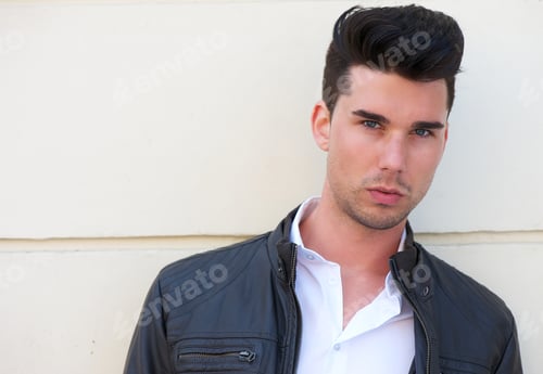 Preview: Handsome young man in black leather jacket