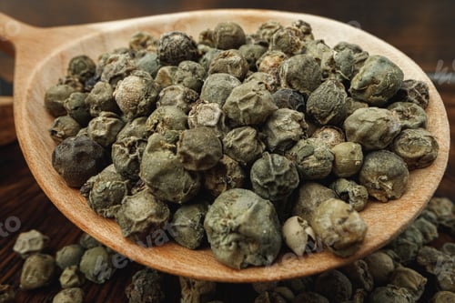 Preview: Macro photo of.green peppercorns on table
