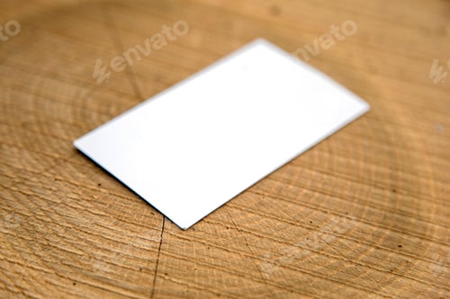 Preview: Blank business card on a wooden surfaces