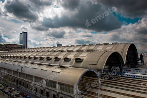 Preview: Majestic train station under a dramatic cloudy sky